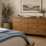 AI-created bedroom styling inspiration with a warm-wood dresser, oatmeal bedding, soft-blue throw and woven textures; not a reviewed product