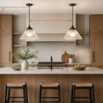 Kitchen island with two pendant lights, measured shade spacing, and a clear sightline across the counter